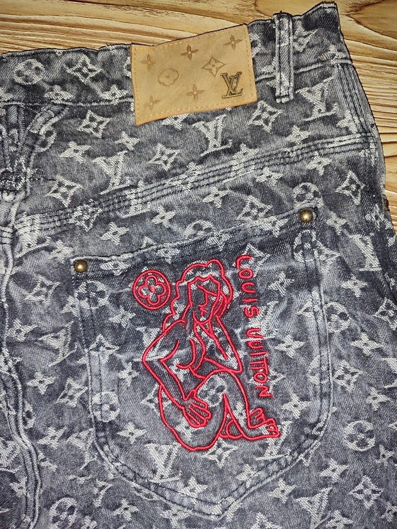 Louis Vuitton Monogram Denim Jeans Size 34 (Category: Jeans) located in Davao. Submitted by valeriajan24414 (Listing ID 1466102862, Image 3). Description: - Brand: Louis Vuitton - Style: Denim jeans in washed dark grey - Design: All-over jacquard monogram pattern with distressed right leg detail - Details: Button fly, branded gold-tone hardware, leather waist patch, and red embroidered rear pocket graphic - Origin: Made in Italy - Size: 34 - 42in