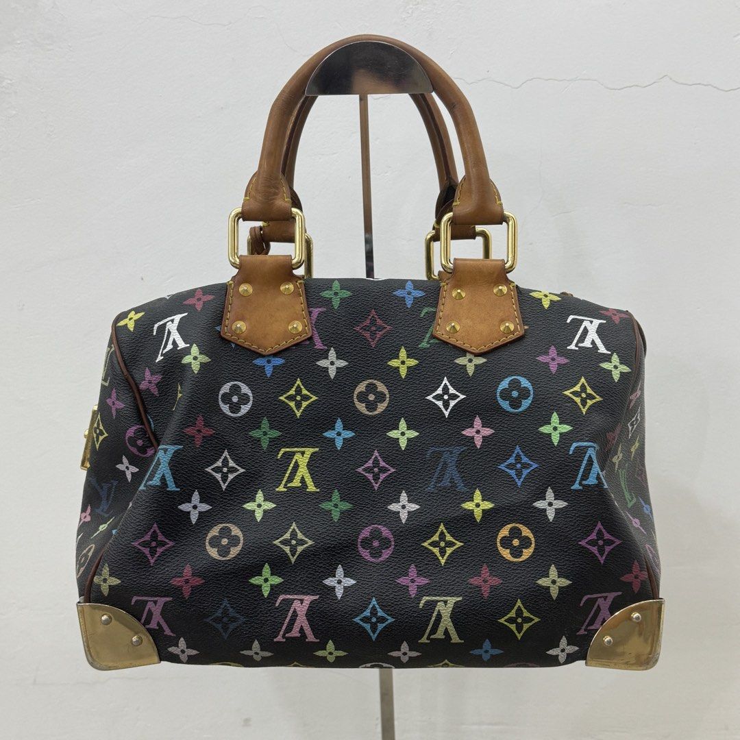 Louis Vuitton Monogram Multicolore Black Speedy 30 Bag (Category: Luxury Bags & Wallets) located in Manila. Submitted by wisecloud_1b4b3c (Listing ID 1466041616, Image 2). Description: - Brand/Model: Louis Vuitton x Takashi Murakami Multicolore Speedy - Color/Material: Black canvas with iconic multicolor monogram - Features: Front pocket with push-lock closure, rolled leather top handles - Condition: Vintage with character, natural honey patina o