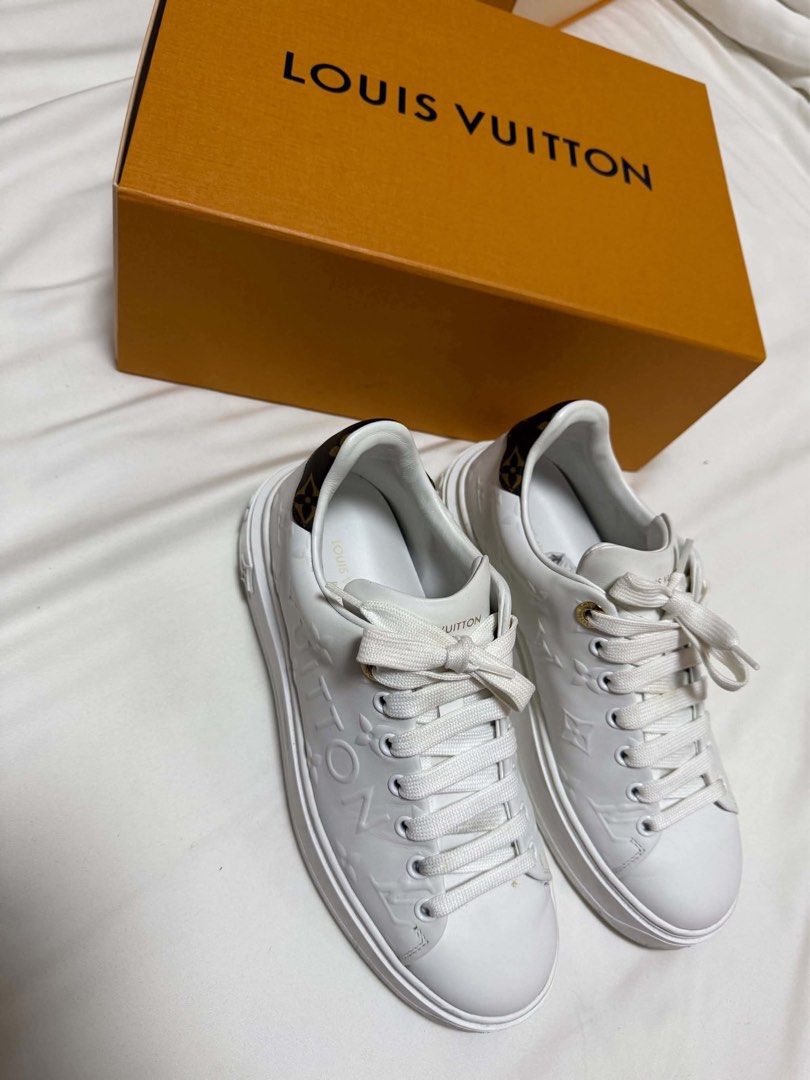 Louis Vuitton White Monogram Leather Sneakers with Box (Category: Sneakers) located in Cainta. Submitted by jtc23 (Listing ID 1466128451, Image 2). Description: - Brand: Louis Vuitton - Style: White leather sneakers with embossed Monogram pattern - Details: Brown Monogram canvas heel tab with LV logo, thick rubber sole with molded flower motifs, and gold foil LV Paris branding on insole - Condition: Clean, well-maintained - Inclusion: Original or
