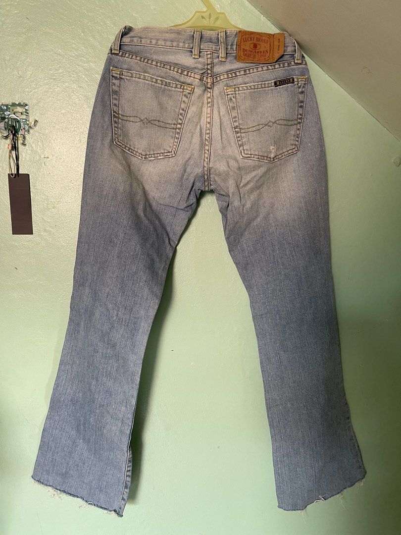 Lucky Brand Dungarees (Category: Jeans) located in Baybay. Submitted by shikita27906 (Listing ID 1466028239, Image 3). Description: - Brand: Lucky Brand Dungarees - Size: 2 (26) - Wash: Light wash denim - Origin: Made in USA - Closure: Button fly - Details: Distressed knees with patch underlay, raw frayed hemline, classic clover back pocket stitch, and brown leather logo patch.