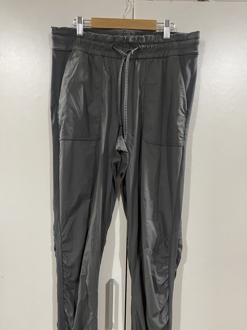 Lululemon Dance Studio Mid-Rise Jogger *Full Length (Category: Activewear) located in Quezon City. Submitted by minethenyours18 (Listing ID 1465991420, Image 1). Description: - Color: Dark Grey - Style: Jogger pants with subtle vertical ribbing - Waistband: Elastic with matching drawstring closure - Pockets: Large front patch pockets on both sides - Details: Ribbed knit panels with gathered ruching on outer legs - Hems: Fitted ribbed cuffs - Cond