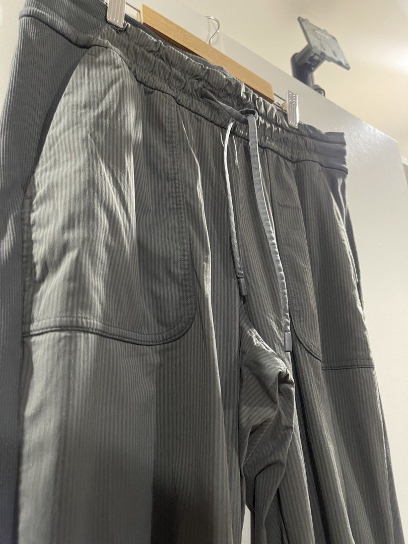 Lululemon Dance Studio Mid-Rise Jogger *Full Length (Category: Activewear) located in Quezon City. Submitted by minethenyours18 (Listing ID 1465991420, Image 3). Description: - Color: Dark Grey - Style: Jogger pants with subtle vertical ribbing - Waistband: Elastic with matching drawstring closure - Pockets: Large front patch pockets on both sides - Details: Ribbed knit panels with gathered ruching on outer legs - Hems: Fitted ribbed cuffs - Cond