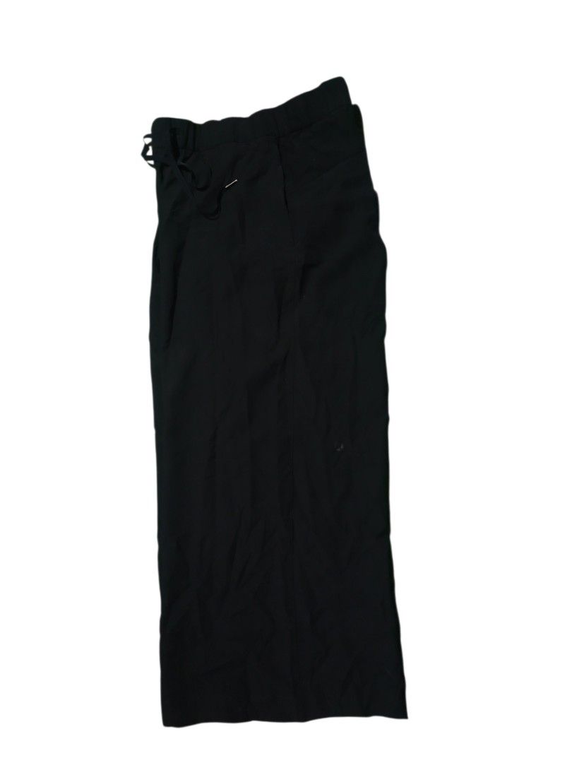Lululemon on the fly wide leg pants(authentic) (Category: Jeans) located in San Jose. Submitted by garments17 (Listing ID 1465918935, Image 2). Description: - Brand: Lululemon - Color: Solid Black - Size: 12 (Tag attached) - Fit: Relaxed fit through the legs with a wide-leg design - Waist: Mid-rise elastic waistband with adjustable drawstring - Details: Classic subtle Lululemon logo stamped on the leg - Condition: Brand new with tags.