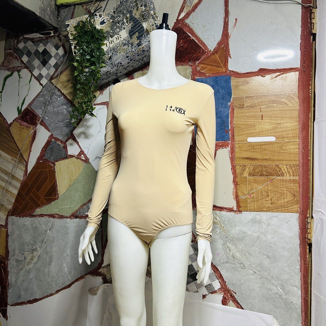 Maison margiela body suit (Category: Luxury Apparel) located in Baguio. Submitted by kckc_luxury (Listing ID 1466082005, Image 2). Description: 🌸 TINY PINK SPOTS ARE LENS DAMAGE, NOT CLOTH STAINS ————————— ❗️KINDLY READ BEFORE MAKING AN OFFER❗️ LISTING DETAILS size:S-M width x length (inches):20x30 condition: EXCELLENT --- MOP: Gcash / BPI MOD: J&T / JRS LOCATION: Baguio City --- NOTE: • Manage your expectations • Photos did not go under any edi