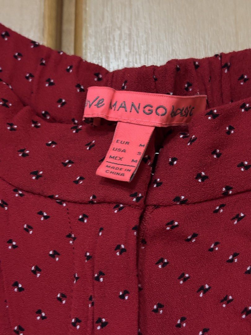 Mango Basic Red Patterned Trousers Size M (Category: Other Bottoms) located in Petaling Jaya. Submitted by anonymous_j (Listing ID 1465995268, Image 2). Description: - Brand: Mango Basic - Color/Pattern: Red with tiny black & white patterns - Fit: Elastic waistband in the back for extra comfort - Fabric: Lightweight and breathable, ideal for daily wear - Size: EUR M - Origin: Made in China - Condition: Clean, well-maintained pre-loved condition.