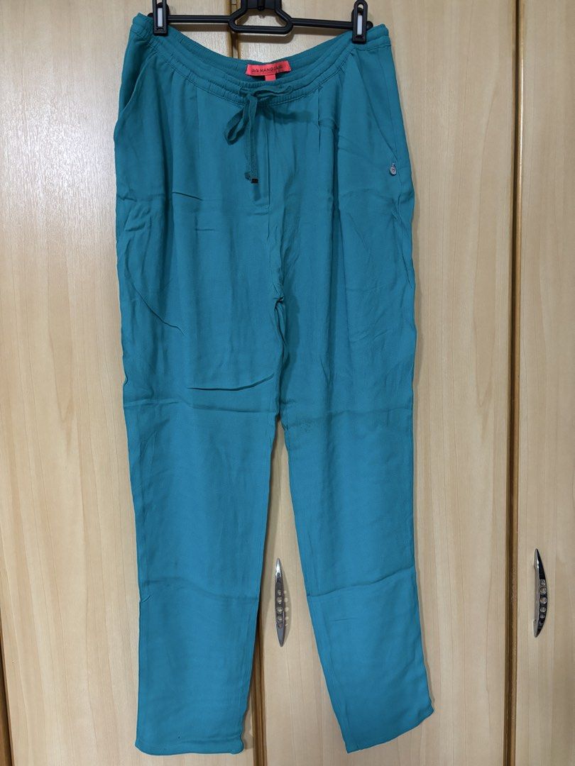 MANGO Basic Teal Drawstring Pants Size M (Category: Other Bottoms) located in Petaling Jaya. Submitted by anonymous_j (Listing ID 1465995091, Image 1). Description: - Brand: Mango Basic - Color: Teal - Size: M - Waistband: Elastic with adjustable drawstring - Pockets: Handy side pockets with metal logo charm - Fit: Relaxed fit for all-day comfort - Condition: Great for everyday casual wear.