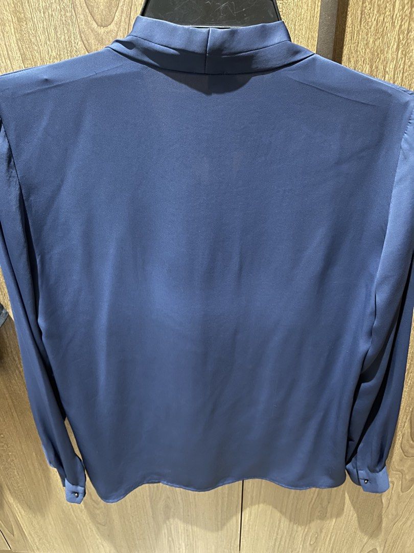 Mango Basics Blue Long Sleeve Blouse Size EUR M (Category: Longsleeves) located in Quezon City. Submitted by epictiger.c6451a (Listing ID 1465963559, Image 2). Description: - Brand: Mango Basics - Color: Blue - Size: EUR M / USA S / MEX M - Material: Smooth fabric with a slight sheen - Design: V-neck with elegant draped front and button cuffs - Origin: Made in Vietnam.