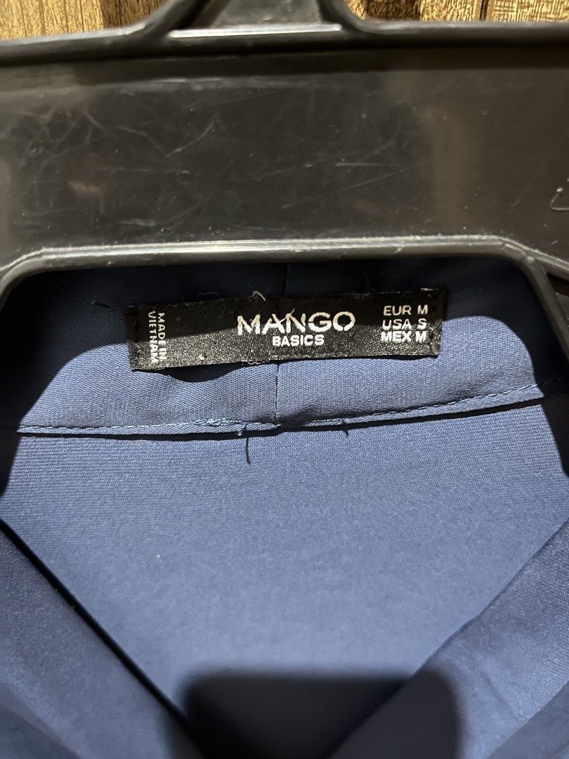 Mango Basics Blue Long Sleeve Blouse Size EUR M (Category: Longsleeves) located in Quezon City. Submitted by epictiger.c6451a (Listing ID 1465963559, Image 3). Description: - Brand: Mango Basics - Color: Blue - Size: EUR M / USA S / MEX M - Material: Smooth fabric with a slight sheen - Design: V-neck with elegant draped front and button cuffs - Origin: Made in Vietnam.