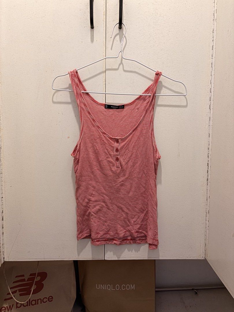 Mango Basics Red Striped Tank Top Size XS (Category: Sleeveless) located in Pasay City. Submitted by notellyyyy (Listing ID 1465992886, Image 1). Description: - Brand: Mango Basics - Design: Red and white stripes with scoop neckline and 3-button front - Size: EUR XS / USA XXS - Material: Lightweight ribbed cotton (Made in Bangladesh) - Condition: Pre-loved with a small hole on the right chest area near the strap - Perfect casual staple for warm w