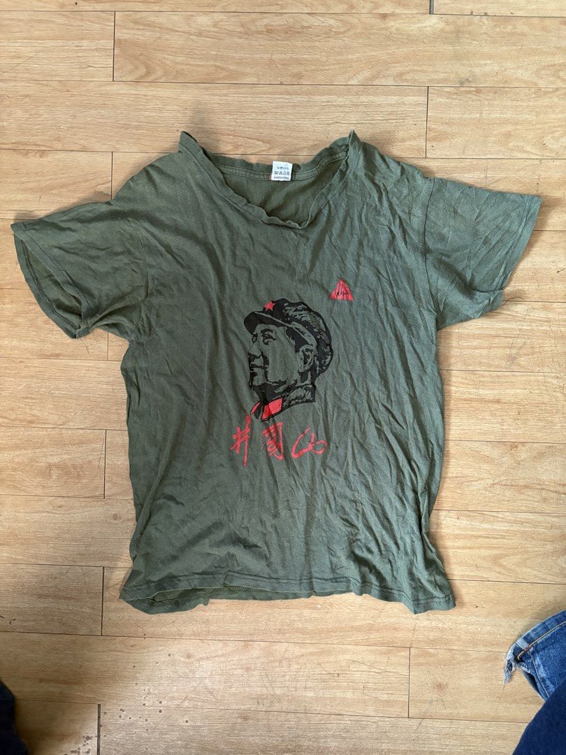 mao zedong tee (pa price check muna) (Category: Tshirts & Polo Shirts ) located in San Mateo. Submitted by swagmaster99 (Listing ID 1466018744, Image 1). Description: - Color: Army green with red Chinese lettering and Mao Zedong graphic print - Size: XXL (Casual fit with classic crew neck) - Material: 100% cotton, Made in China - Details: Features a small red logo triangle above the chest.