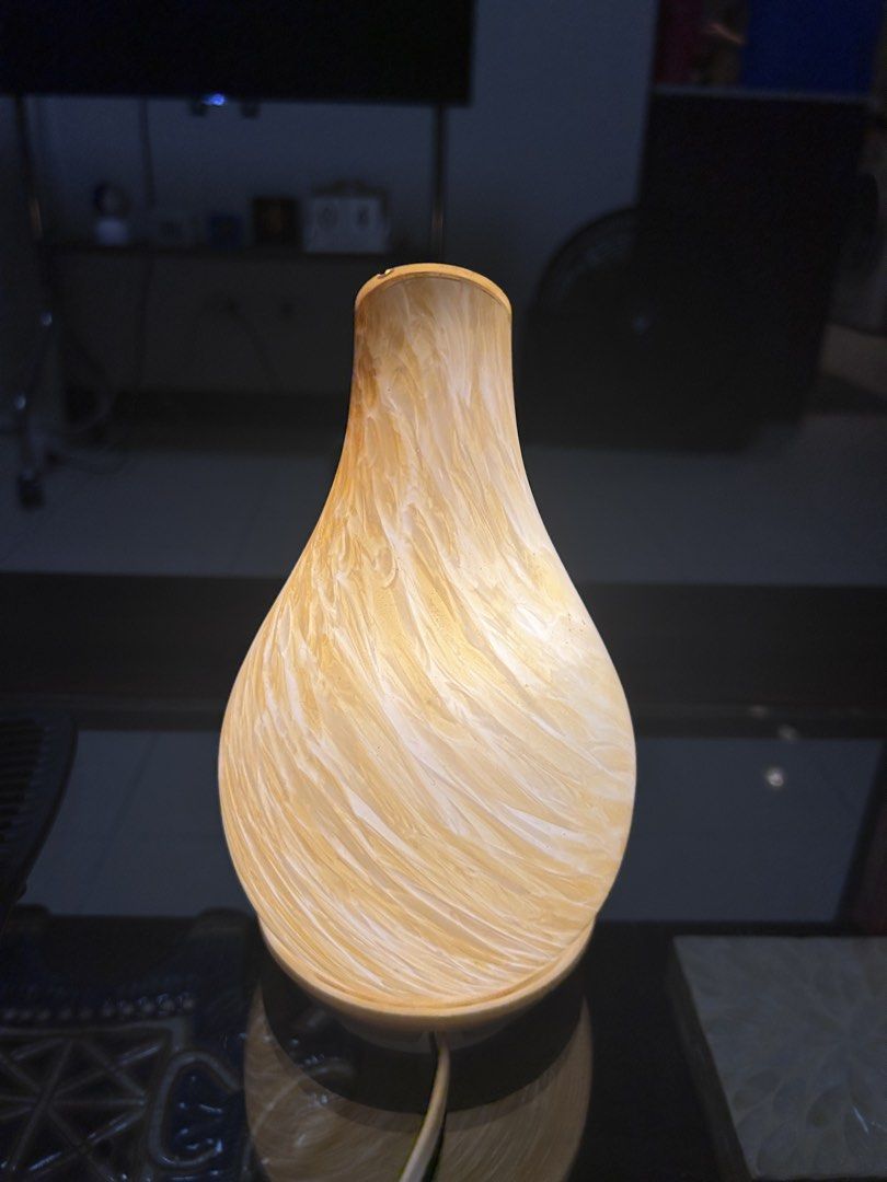 Marble Pattern Ceramic Essential Oil Diffuser / Lamp (Category: Home Fragrance) located in Del Monte. Submitted by roseanncub90895 (Listing ID 1466068175, Image 1). Description: - Elegant teardrop ceramic diffuser / lamp in a stunning marbled yellow and white finish - Features a cozy soft warm glow when turned on - Compact size fits perfectly on bedside tables or office desks - Easy to clean and maintain between uses - Comes with a power cord, re