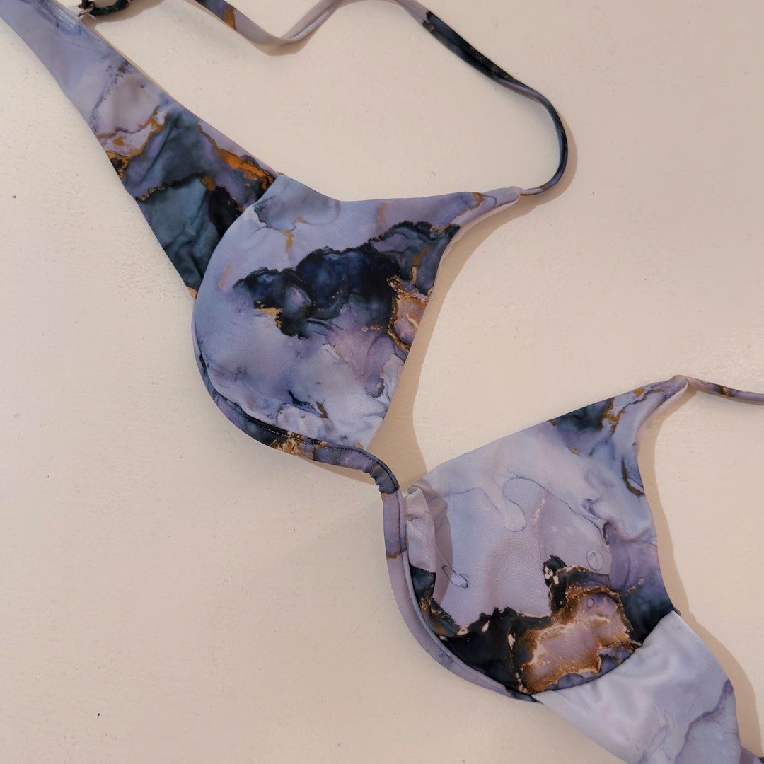 Marble print underwire bikini top purple gold (Category: Bikinis & Swimsuits) located in Cebu City. Submitted by softly.preloved (Listing ID 1466149146, Image 2). Description: - no issues -purple and blue marble print bikini top with chic gold foil details - underwire cups offer solid shape and dependable support - Secure back clasp closure.
