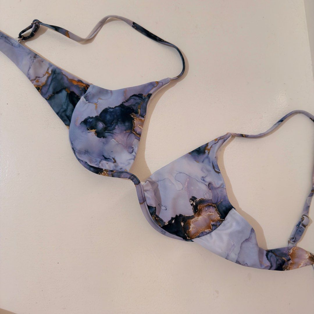 Marble print underwire bikini top purple gold (Category: Bikinis & Swimsuits) located in Cebu City. Submitted by softly.preloved (Listing ID 1466149146, Image 1). Description: - no issues -purple and blue marble print bikini top with chic gold foil details - underwire cups offer solid shape and dependable support - Secure back clasp closure.