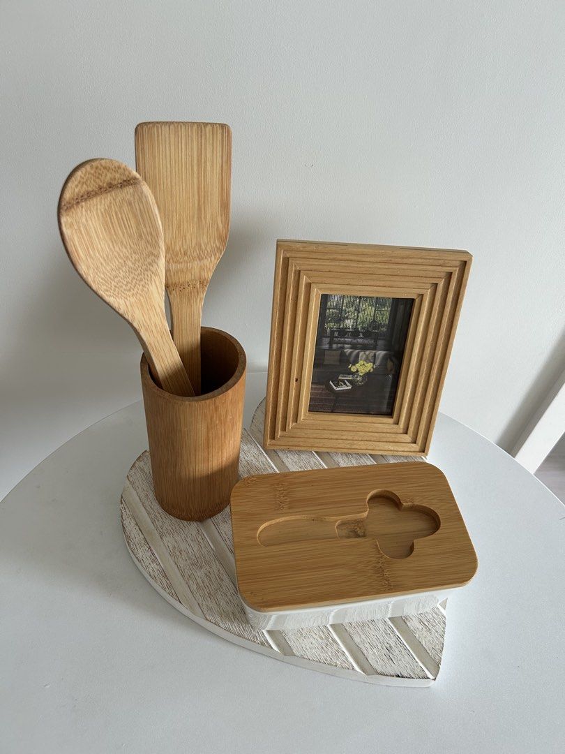 Matching kitchen and home decor set (Category: Dinnerware & Cutlery) located in Quezon City. Submitted by curatedfindsy (Listing ID 1465984972, Image 2). Description: Selling everything together as a set TAKE ALL ₱350 Inclusions: Wooden utensils in a holder, butter dish with wooden lid, small wooden photo frame, and white heart-shaped wooden tray. Minimalist look for countertops and dining tables. 📍Quezon City .