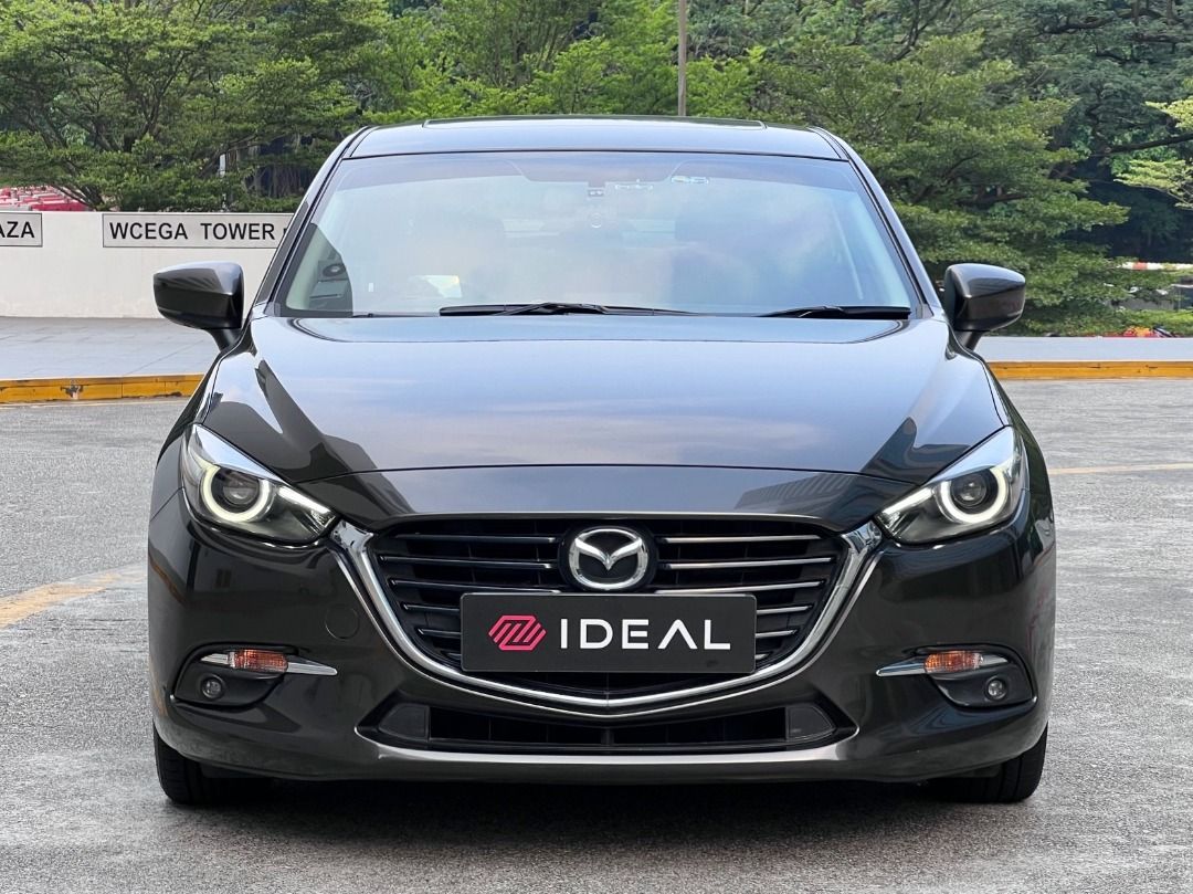 Mazda 3 Sedan 1.5 Deluxe (A) (Category: Used Cars) located in Singapore. Submitted by idealauto (Listing ID 1465991691, Image 2). Description: Features 1.5L 4 cylinder inline 16 valves DOHC, 6 speed SkyActiv-G engine producing 118bhp and 150nm of torque. Keyless entry/start/stop. Accessories Electric leather seats, sports rims, Sunroof, factory fitted audio with HUD/GPS/steering control, reverse camera/sensors, fog lights, folding mirrors. Descri