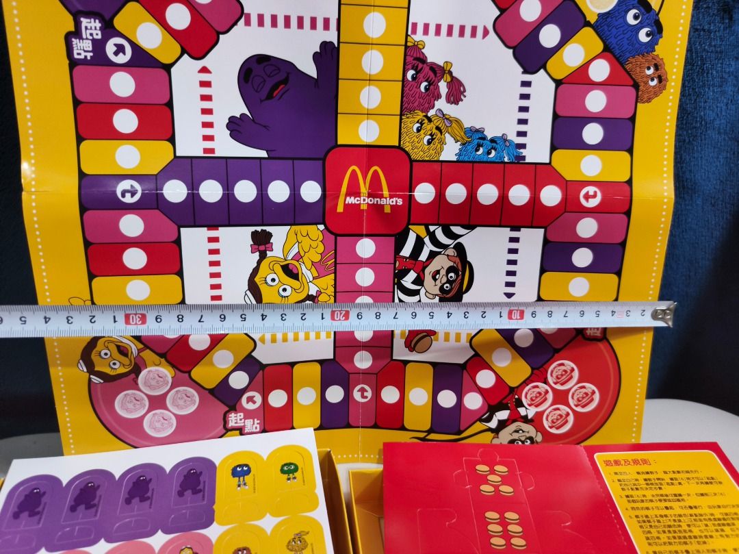 McDonald's Retro Character Board Game (Category: Board Games & Puzzles) located in San Leonardo. Submitted by burgossanleonardo.12345 (Listing ID 1466102491, Image 3). Description: - Vintage McDonald's board game featuring classic characters like Grimace and Hamburglar - Includes vibrant yellow game board, unpunched character token sheets, and original instructions - Everything packs neatly inside the iconic branded yellow box - Rare and collecti