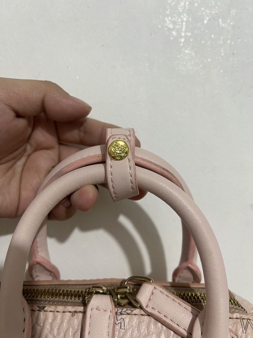 MCM monogram sling bag (Category: Luxury Bags & Wallets) located in Manila. Submitted by pppsss_____ (Listing ID 1466074939, Image 3). Description: original w/ code needs to be cleaned but still in good condition and it's really pretty ♡.