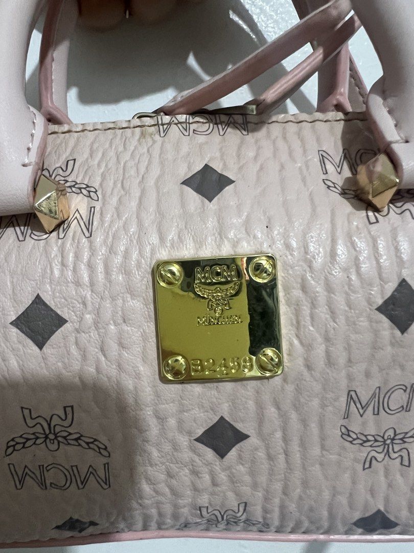 MCM monogram sling bag (Category: Luxury Bags & Wallets) located in Manila. Submitted by pppsss_____ (Listing ID 1466074939, Image 2). Description: original w/ code needs to be cleaned but still in good condition and it's really pretty ♡.