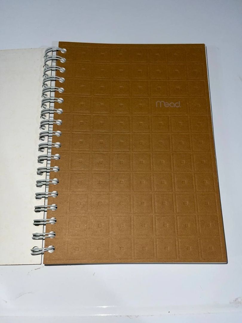 Mead brown grid texture spiral notebook (Category: Stationery & School Supplies) located in Quezon City. Submitted by randomseller09 (Listing ID 1466063066, Image 1). Description: In great condition. Never been used. Was just stored at our old house so I'm selling it. - Brand: Mead - Cover: Textured brown with embossed geometric grid pattern - Binding: Sturdy white side spiral - Material: Durable cardboard cover for extra protection - Condition: 