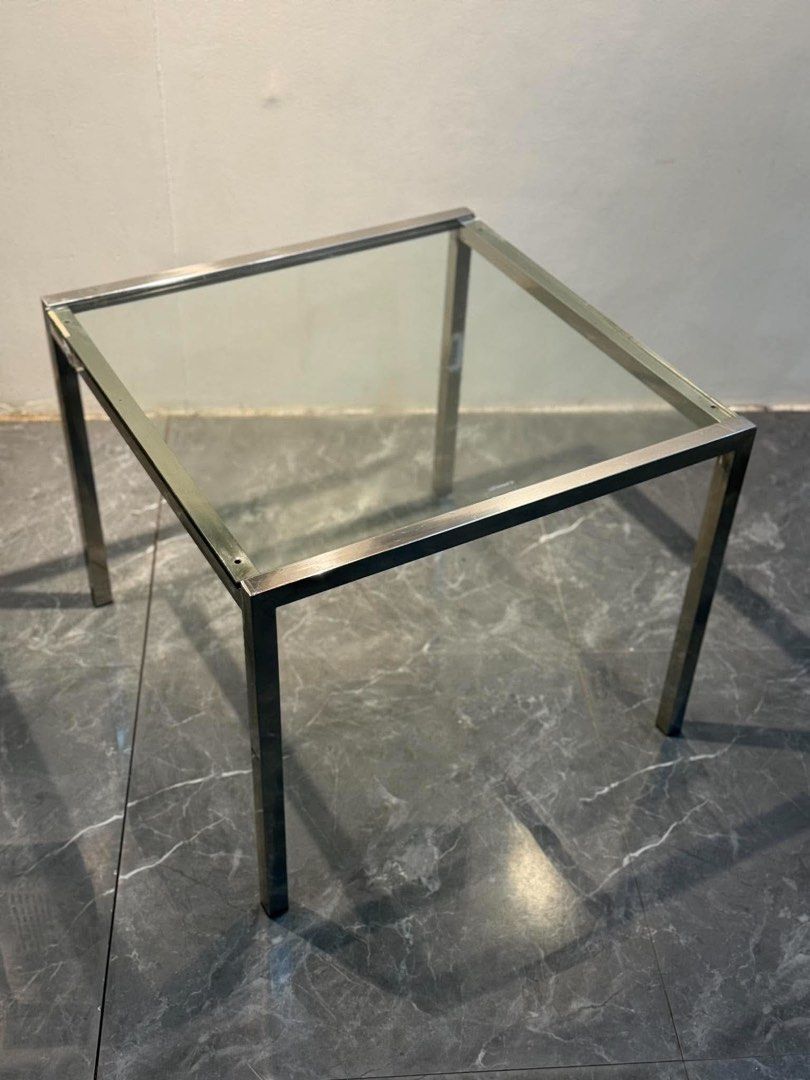 Metal Frame Glass Top Side Table (Category: Tables & Sets) located in Manila. Submitted by bacsaljose40805 (Listing ID 1466023688, Image 1). Description: - Sleek square side table with a clear glass top and silver metal frame - Simple, modern design that complements any interior style - Sturdy steel legs ensure solid and reliable support - Compact footprint is ideal for saving floor space - Versatile piece that works great next to a sofa or bed.