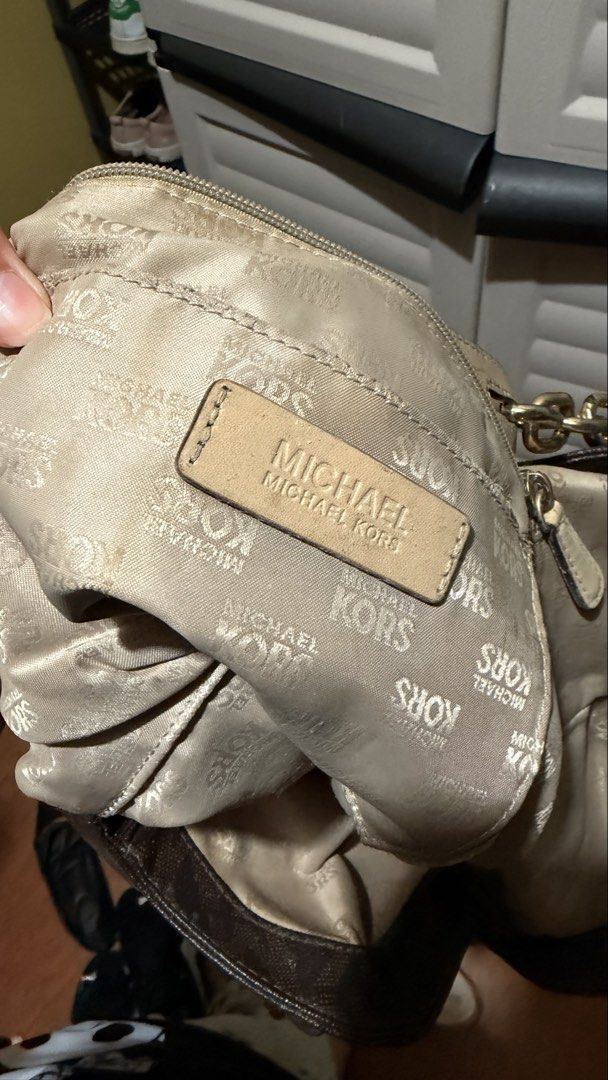 Michael Kors Brown Monogram Shoulder Bag with Chain Straps (Category: Luxury Bags & Wallets) located in Manila. Submitted by swiftdragon.6d8469 (Listing ID 1466064523, Image 2). Description: - Michael Kors brown monogram shoulder bag - Natural wear on the light leather strap handles from regular use -neg.