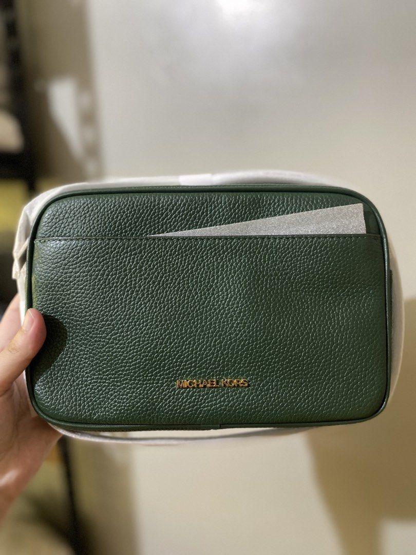 Michael Kors Green Crossbody Bag (Category: Cross-body Bags) located in Batangas. Submitted by lux_kimmy (Listing ID 1465988751, Image 1). Description: - Brand: Michael Kors - Color: Green - Material: Clean pebble leather - Style: Structured boxy crossbody bag with gold-tone hardware - Features: Secure zipper closure and convenient front slip pocket - Condition: Brand new, strap still wrapped in original factory protective foam - Size: Compact, f