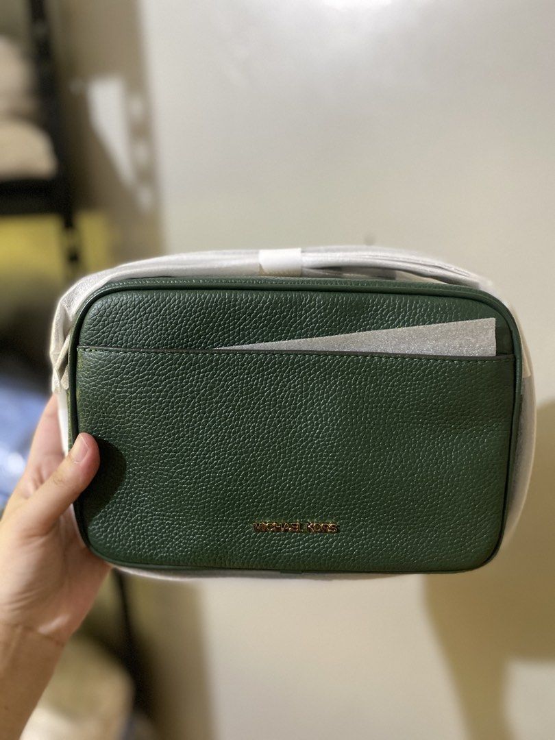 Michael Kors Green Crossbody Bag (Category: Cross-body Bags) located in Batangas. Submitted by lux_kimmy (Listing ID 1465988751, Image 2). Description: - Brand: Michael Kors - Color: Green - Material: Clean pebble leather - Style: Structured boxy crossbody bag with gold-tone hardware - Features: Secure zipper closure and convenient front slip pocket - Condition: Brand new, strap still wrapped in original factory protective foam - Size: Compact, f