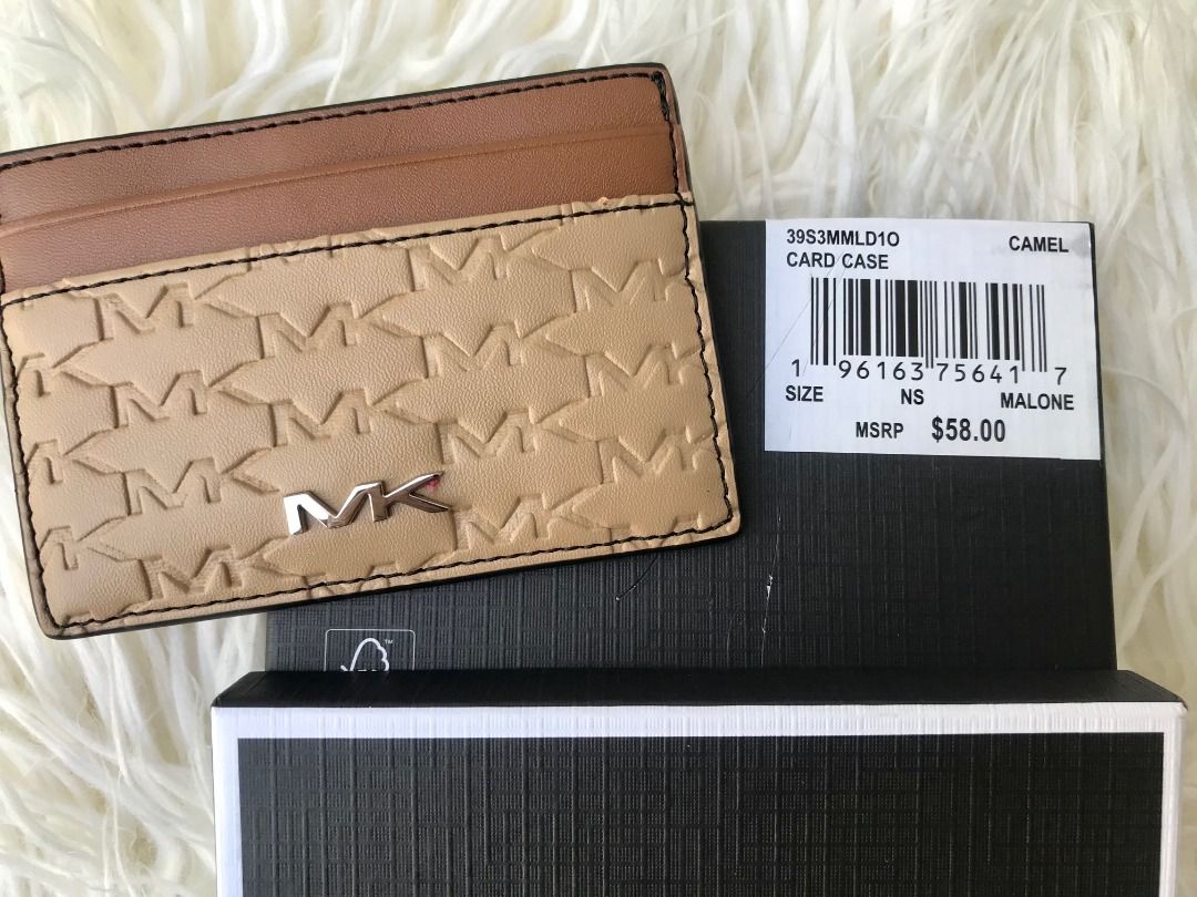 Michael Kors Malone Card Case Camel BNIB (Category: Luxury Bags & Wallets) located in Las Pinas. Submitted by anonymously_shopaholic (Listing ID 1466016848, Image 3). Description: - Brand: Michael Kors - Style: Malone Card Case - Color: Camel with brown accents - Material: Monogram embossed leather - Hardware: Silver-tone MK logo - Features: Top card slots for easy access - Condition: Brand new with tag attached - Inclusions: Original Michael Kor