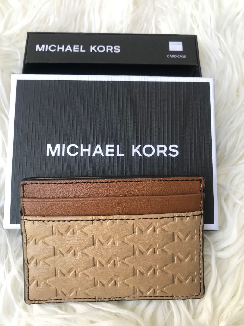 Michael Kors Malone Card Case Camel BNIB (Category: Luxury Bags & Wallets) located in Las Pinas. Submitted by anonymously_shopaholic (Listing ID 1466016848, Image 2). Description: - Brand: Michael Kors - Style: Malone Card Case - Color: Camel with brown accents - Material: Monogram embossed leather - Hardware: Silver-tone MK logo - Features: Top card slots for easy access - Condition: Brand new with tag attached - Inclusions: Original Michael Kor