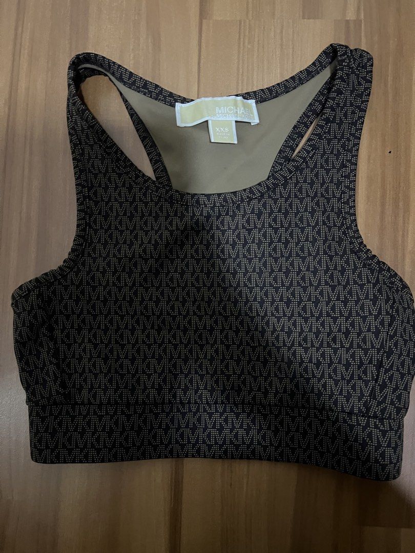 Buy 1 take 1 MK top (Category: Activewear) located in Manila. Submitted by icaricsz_szs (Listing ID 1466060230, Image 1). Description: - Authentic Michael Kors 2-piece athleisure set in great, clean condition - Piece 1: Allover MK monogram sports bra, racerback style with supportive underband, Size XXS (Made in China) - Piece 2: Solid black velour crop top with embroidered MK circle logo, Size XS/TP (Made in Vietnam) - Both items are well-maintai