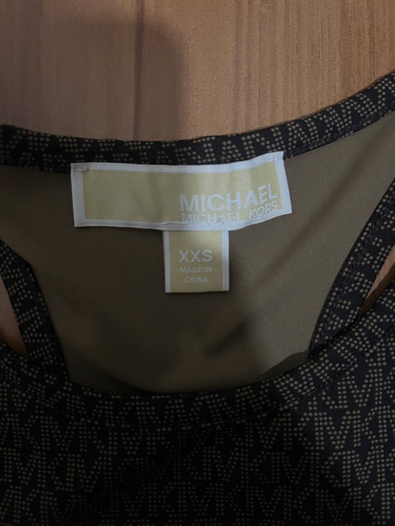 Buy 1 take 1 MK top (Category: Activewear) located in Manila. Submitted by icaricsz_szs (Listing ID 1466060230, Image 2). Description: - Authentic Michael Kors 2-piece athleisure set in great, clean condition - Piece 1: Allover MK monogram sports bra, racerback style with supportive underband, Size XXS (Made in China) - Piece 2: Solid black velour crop top with embroidered MK circle logo, Size XS/TP (Made in Vietnam) - Both items are well-maintai