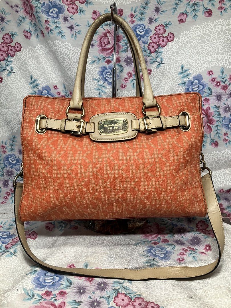 MICHAEL KORS ORANGE MONOGRAM CROSSBODY /SHOULDER BAG (Category: Cross-body Bags) located in General Mariano Alvarez. Submitted by adonid (Listing ID 1466027158, Image 1). Description: MICHAEL KORS ORANGE MONOGRAM CROSSBODY /SHOULDER BAG GOOD CONDITION NORMAL SIGN OF USAGE ONLY.