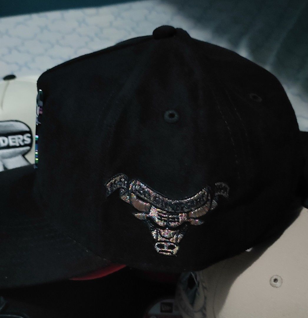 Mitchell & Ness Chicago Bulls Windy City Snapback Cap (Category: Caps & Hats) located in Manila. Submitted by acdouble-r (Listing ID 1466073422, Image 2). Description: - Brand: Mitchell & Ness - Team: Chicago Bulls - Fit: Pro-Pinch Snapback - Color: Black Suede body with metallic iridescent Bulls logo on front and side - Undervisor: Vibrant pink under brim - Condition: Brand new, never worn, with interior branding tape - Extras: Original stickers
