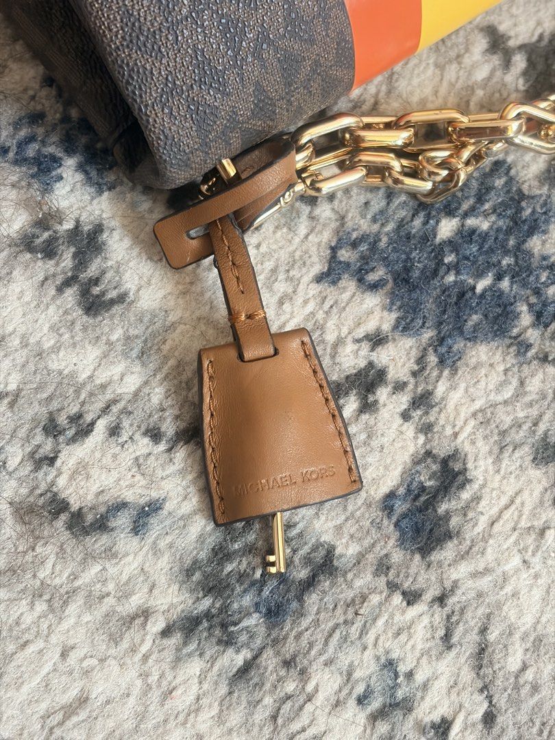 Mk crossbody (Category: Cross-body Bags) located in San Pascual. Submitted by s3resale (Listing ID 1465964711, Image 3). Description: Rubber linning issue s strap lang(Due to improper storage)pero gold pa hardware. Free sf around luzon area only. .