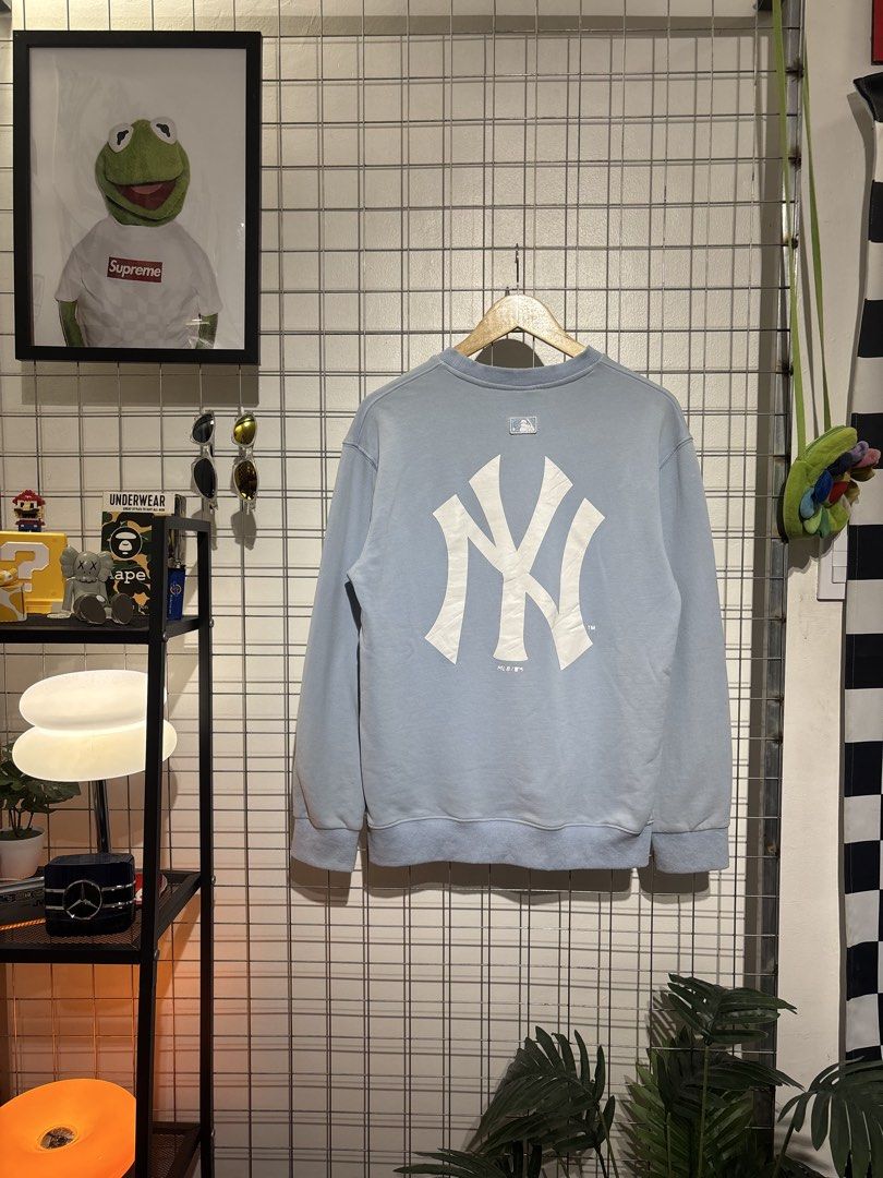 MLB New York Yankees Light Blue Sweatshirt (Category: Coats, Jackets and Outerwear) located in Cavite. Submitted by vlblgrmnts_ (Listing ID 1466071959, Image 1). Description: MLB - p-257 20x27 Bestfit meduim 9/10 CR 700 - Authentic MLB New York Yankees sweatshirt in light blue - Eye-catching embroidered French bulldog graphic with text on the chest - Large white NY logo printed on the back - Comfortable ribbed collar, cuffs, and hem - Finished wi