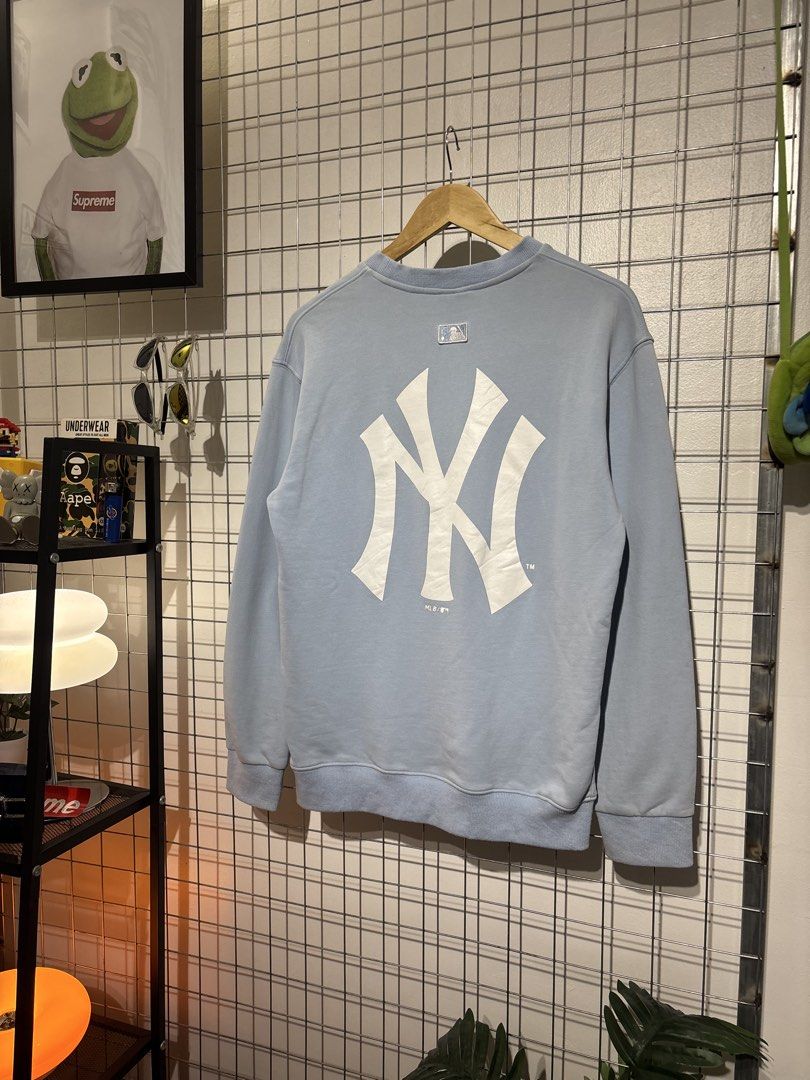 MLB New York Yankees Light Blue Sweatshirt (Category: Coats, Jackets and Outerwear) located in Cavite. Submitted by vlblgrmnts_ (Listing ID 1466071959, Image 2). Description: MLB - p-257 20x27 Bestfit meduim 9/10 CR 700 - Authentic MLB New York Yankees sweatshirt in light blue - Eye-catching embroidered French bulldog graphic with text on the chest - Large white NY logo printed on the back - Comfortable ribbed collar, cuffs, and hem - Finished wi