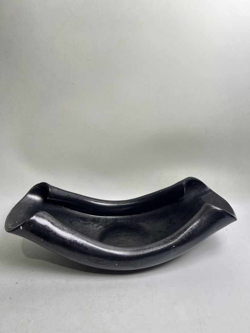Modern Black Ceramic Decorative Bowl (Category: Vases & Decorative Bowls) located in Baguio. Submitted by chiechie1234 (Listing ID 1466070873, Image 1). Description: - Unique black ceramic bowl with a contemporary design - Matte finish featuring a subtle speckled texture - Deep basin perfect for fruits, decor, or as a standalone centerpiece - Heavy and solid construction for durability - Fits seamlessly into minimalist and modern home aesthetics.