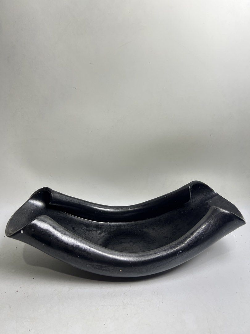 Modern Black Ceramic Decorative Bowl (Category: Vases & Decorative Bowls) located in Baguio. Submitted by chiechie1234 (Listing ID 1466070873, Image 2). Description: - Unique black ceramic bowl with a contemporary design - Matte finish featuring a subtle speckled texture - Deep basin perfect for fruits, decor, or as a standalone centerpiece - Heavy and solid construction for durability - Fits seamlessly into minimalist and modern home aesthetics.