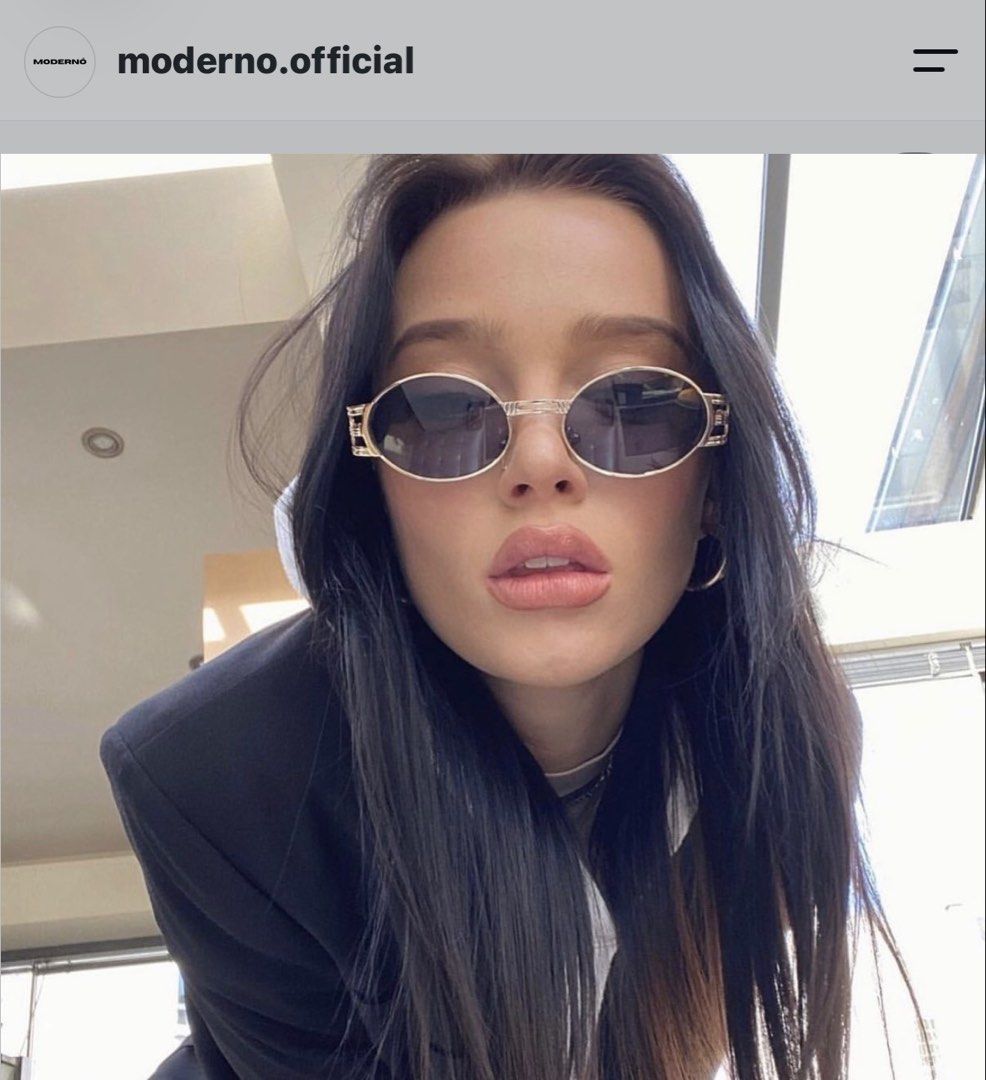 MODERNO Oval Sunglasses with Metallic Frame and Case (Category: Sunglasses & Eyewear) located in Pasig City. Submitted by miss_abuelita (Listing ID 1465977927, Image 1). Description: - Brand: MODERNO - Style: Oval sunglasses with dark tint - Frame: Gold-tone metallic with unique geometric side details and branded temples - Condition: Unused and brand new (protective wrapping still attached on the arm) - Inclusions: Matching silver textured case w