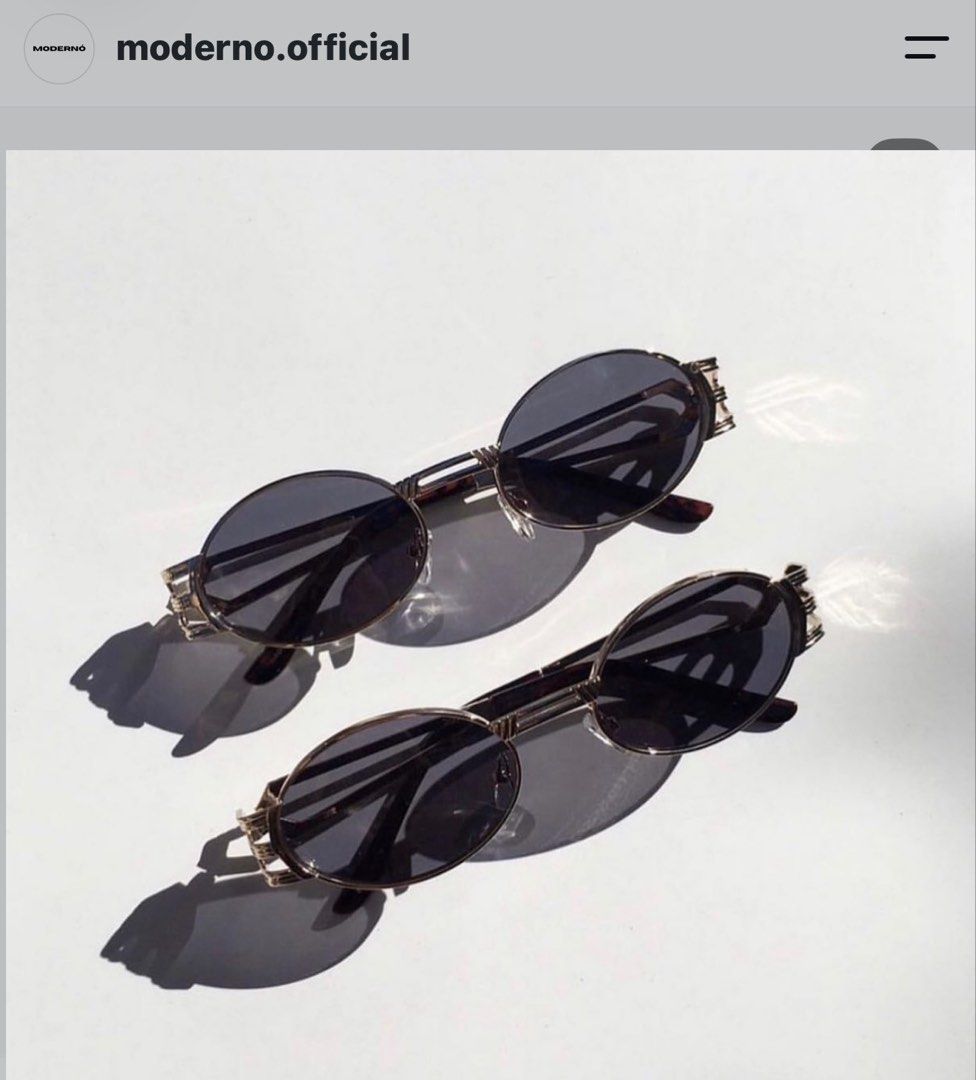 MODERNO Oval Sunglasses with Metallic Frame and Case (Category: Sunglasses & Eyewear) located in Pasig City. Submitted by miss_abuelita (Listing ID 1465977927, Image 2). Description: - Brand: MODERNO - Style: Oval sunglasses with dark tint - Frame: Gold-tone metallic with unique geometric side details and branded temples - Condition: Unused and brand new (protective wrapping still attached on the arm) - Inclusions: Matching silver textured case w