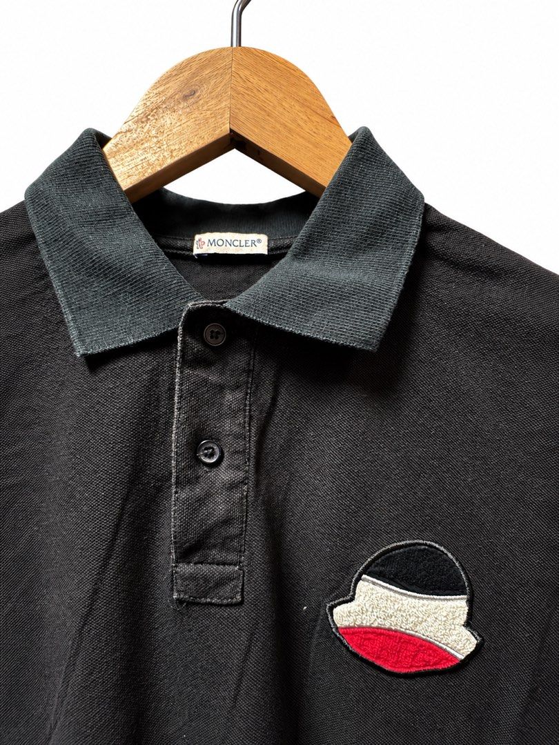 Moncler Black Polo Shirt Size S (Category: Tshirts & Polo Shirts ) located in Tangub. Submitted by laurbepena33002 (Listing ID 1465958335, Image 2). Description: - Brand: Moncler - Item: Polo Shirt - Color: Black with washed effect on collar and seams - Size: S -Dimension: W19”xL24” - Material: 100% cotton pique - Origin: Made in Turkey - Features: Short sleeves, classic collar, two-button placket, large terrycloth Moncler logo patch on left ches