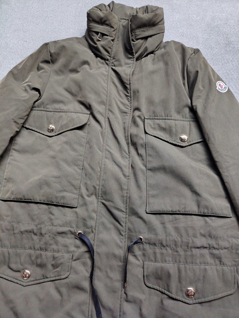 Moncler Margarita Parka Jacket (Category: Coats, Jackets and Outerwear) located in Taguig. Submitted by _theroom.ph (Listing ID 1465986878, Image 2). Description: - Authentic Moncler puffer parka in stylish olive green - High stand-up collar with cool zip details - Four front flap pockets featuring gold-tone branded buttons - Adjustable drawstring waist to flatter your shape - Classic Moncler felt logo patch on the sleeve - Cozy black quilted inn