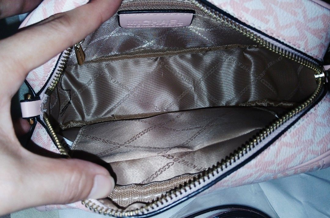 Monogram Crossbody Bag (Category: Cross-body Bags) located in Las Pinas. Submitted by anna_katrina (Listing ID 1466076241, Image 2). Description: - Brand: Michael Kors - Style: Crossbody bag in pink with all-over MK monogram - Hardware: Premium gold-tone logo hardware - Closure & Interior: Secure zip-top closure with a clean lined interior and slip pockets - Condition: Excellent, clean inside and out - Inclusions: Detachable pink shoulder strap, 