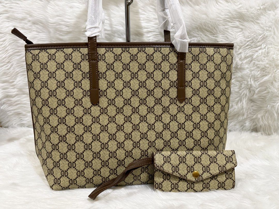 Monogram Tote Bag with Matching Wallet Set (Category: Tote Bags) located in Taguig. Submitted by roseanneramirez (Listing ID 1466026523, Image 1). Description: - Brand new brown monogram faux leather tote bag - Features dark brown trim and sturdy shoulder straps (straps still wrapped in protective tissue) - Includes a matching small envelope-style wallet with a gold-tone snap button closure - Roomy interior, great as an everyday carryall - Pickup