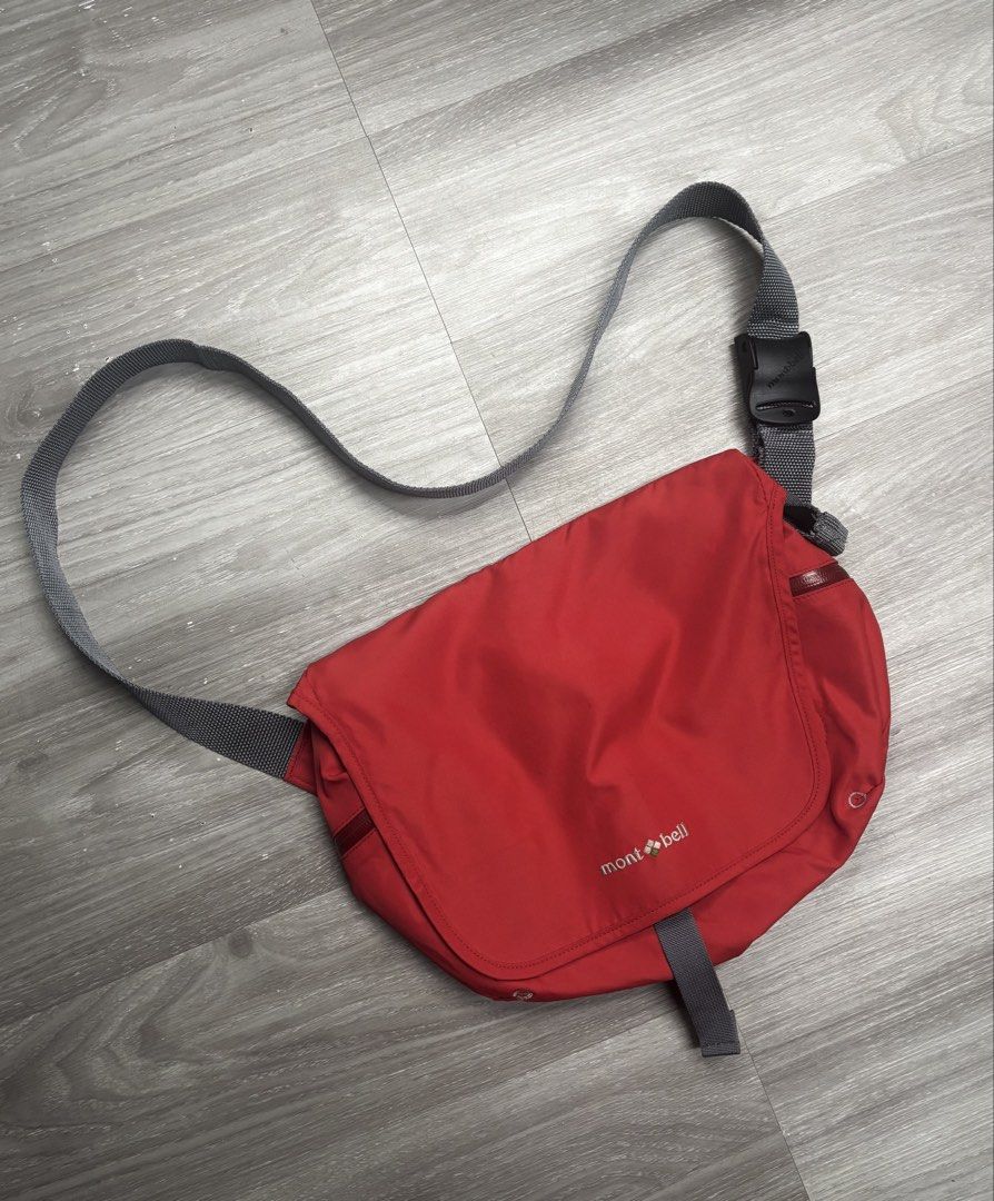 Montbell Bernina Flap Shoulder Bag (Category: Sling Bags) located in Pagadian. Submitted by afterwearph (Listing ID 1466076445, Image 1). Description: - Brand/Model: Authentic Mont-bell messenger bag - Color: Bright red with an adjustable grey shoulder strap - Material: Durable nylon (Made in Vietnam) - Closure: Secure buckle fastening and velcro panels - Storage: Main compartment with a zippered interior pocket and key clip - Medium size, which 