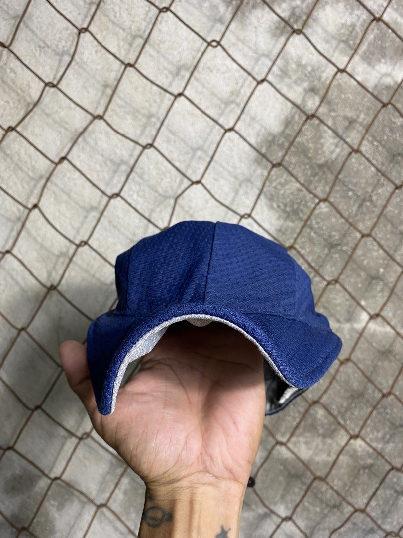 Mont-bell Navy Cycling Cap (Category: Caps & Hats) located in Cabanatuan. Submitted by adrialesdrip (Listing ID 1466076869, Image 2). Description: - Brand: Mont-bell - Color: Navy blue with grey inner lining - Material: Breathable mesh fabric - Fit: Adjustable toggle drawstring closure at the back - Details: Woven logo tag on the side - Condition: Clean and ready to wear.