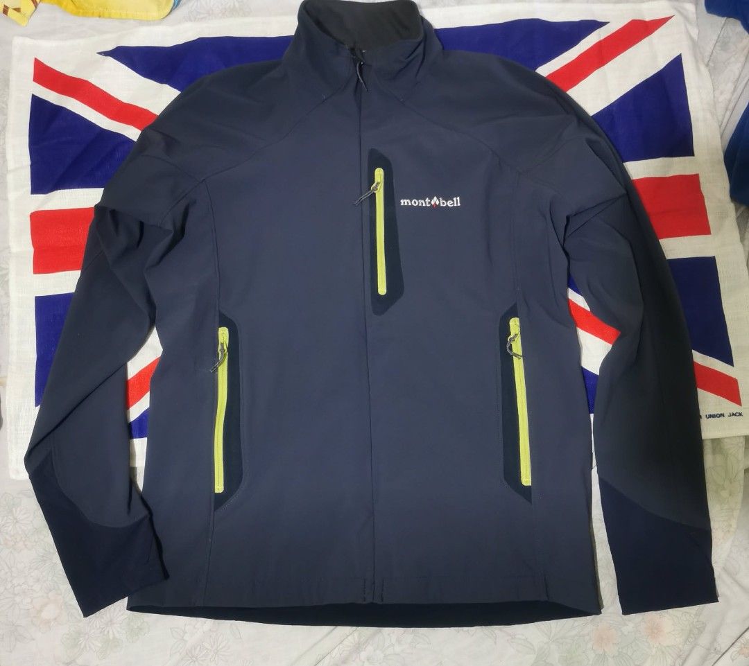 Montbell Soft Shell Jacket Navy Blue Size S (Category: Coats, Jackets and Outerwear) located in Makati City. Submitted by relianzmae57131 (Listing ID 1466032430, Image 1). Description: - Brand: Montbell - Color: Dark navy blue with lime green zipper accents and inner collar trim - Size: Small - Features: Embroidered brand logo on chest and upper back collar, zippered right chest pocket - Style: Soft shell jacket, lightweight and stylish.