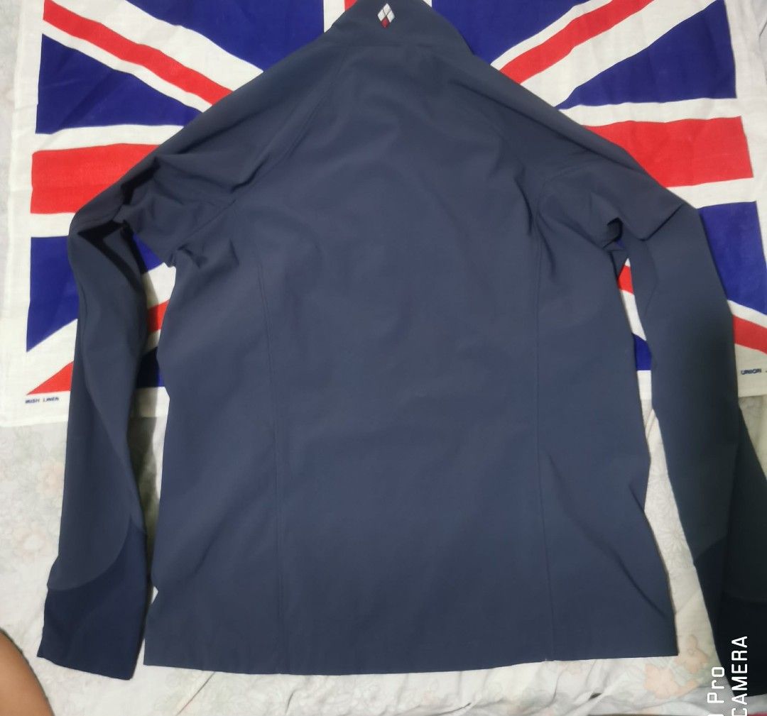 Montbell Soft Shell Jacket Navy Blue Size S (Category: Coats, Jackets and Outerwear) located in Makati City. Submitted by relianzmae57131 (Listing ID 1466032430, Image 2). Description: - Brand: Montbell - Color: Dark navy blue with lime green zipper accents and inner collar trim - Size: Small - Features: Embroidered brand logo on chest and upper back collar, zippered right chest pocket - Style: Soft shell jacket, lightweight and stylish.