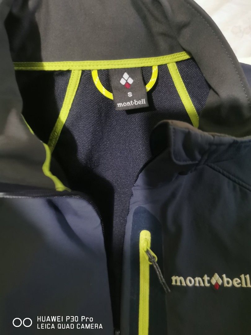 Montbell Soft Shell Jacket Navy Blue Size S (Category: Coats, Jackets and Outerwear) located in Makati City. Submitted by relianzmae57131 (Listing ID 1466032430, Image 3). Description: - Brand: Montbell - Color: Dark navy blue with lime green zipper accents and inner collar trim - Size: Small - Features: Embroidered brand logo on chest and upper back collar, zippered right chest pocket - Style: Soft shell jacket, lightweight and stylish.