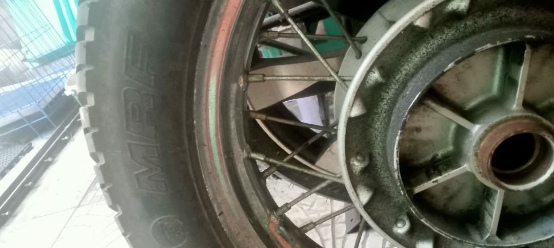 Motorcycle Tire Rubber Tread (Category: Other Motorcycles Parts and Accessories) located in Manila. Submitted by 08jhoyglee64228 (Listing ID 1465970806, Image 2). Description: - Type: Black rubber motorcycle/scooter tire - Condition: Used with visible tread wear - Tread: Standard pattern with grooves for road grip - Usage: Plenty of life left for daily commutes - Availability: Grab it before someone else does!.